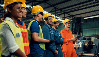 Skillful worker attending brief meeting in the factory .