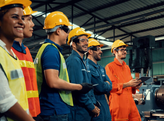 Skillful worker attending brief meeting in the factory .